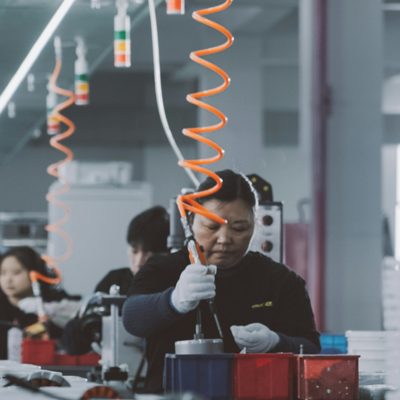 Technician performing prototype testing and engineering validation